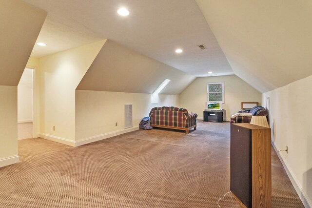 carpeted bedroom with baseboards, visible vents, vaulted ceiling, and recessed lighting