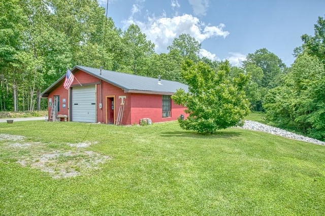 5088 Baptist Ridge Rd, Hilham, TN 38568 - view of green lawn with a detached garage