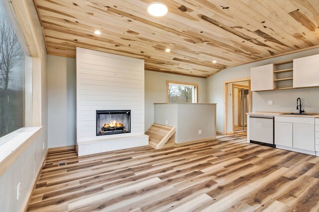 kitchen with dishwasher, open shelves, wooden ceiling, and a sink