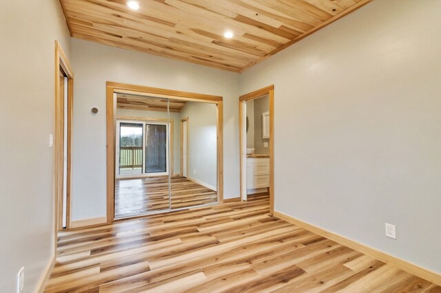 unfurnished room with light wood finished floors, wooden ceiling, recessed lighting, and baseboards