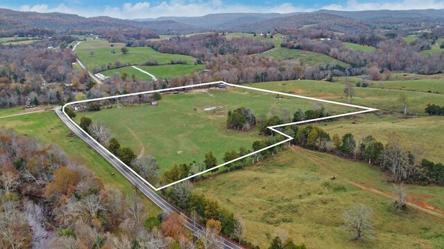 drone / aerial view featuring a rural view and a mountain view