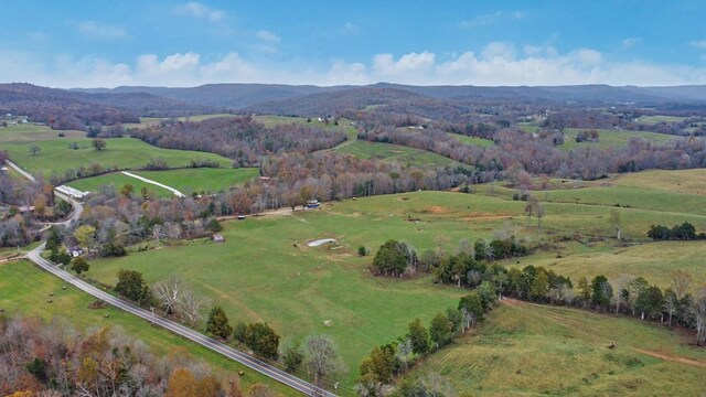 drone / aerial view featuring a rural view and a mountain view