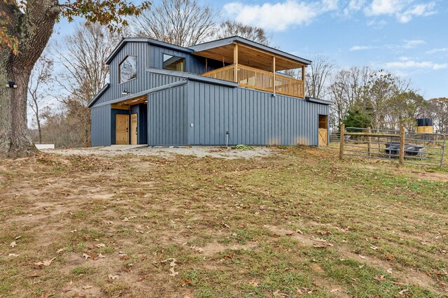 view of home's exterior featuring an outbuilding