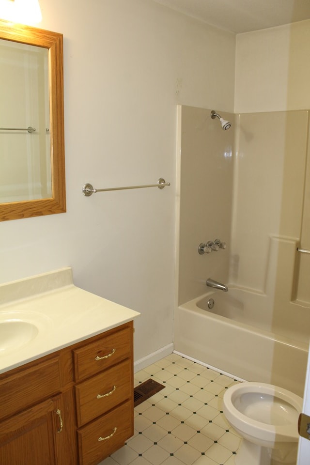 full bath with visible vents, toilet, vanity, shower / tub combination, and baseboards