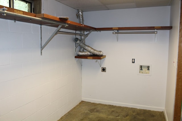 laundry area with washer hookup, concrete block wall, electric dryer hookup, and baseboards