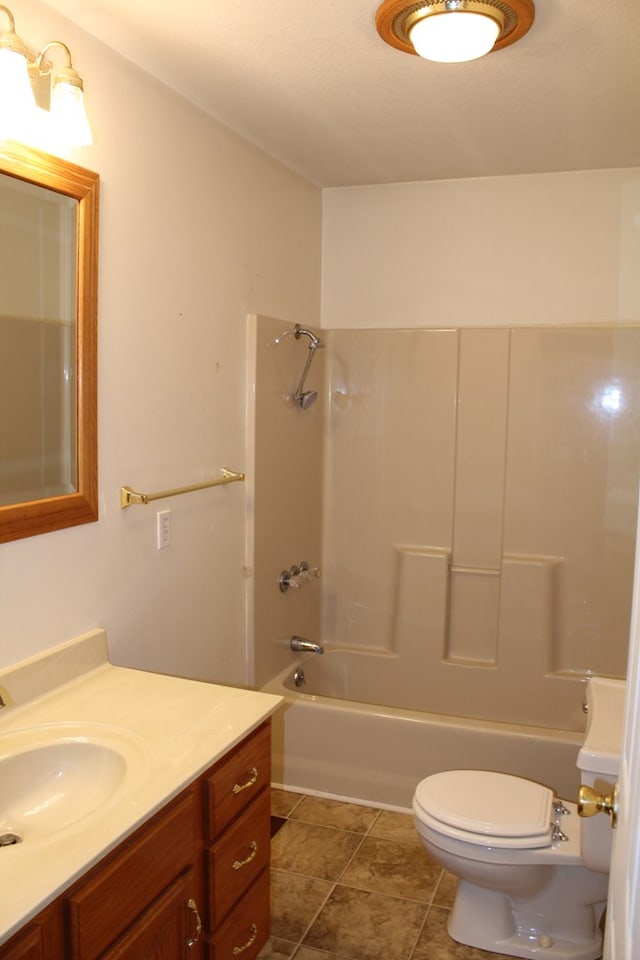 full bath featuring toilet, shower / tub combination, tile patterned flooring, and vanity