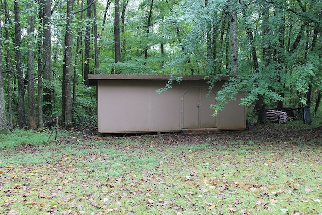 exterior space with a storage unit and an outdoor structure