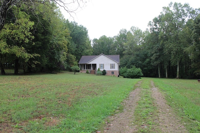 ranch-style house featuring crawl space, driveway, and a front yard