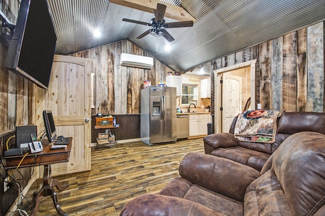 living area with lofted ceiling, wooden walls, wood finished floors, a ceiling fan, and a wall mounted air conditioner