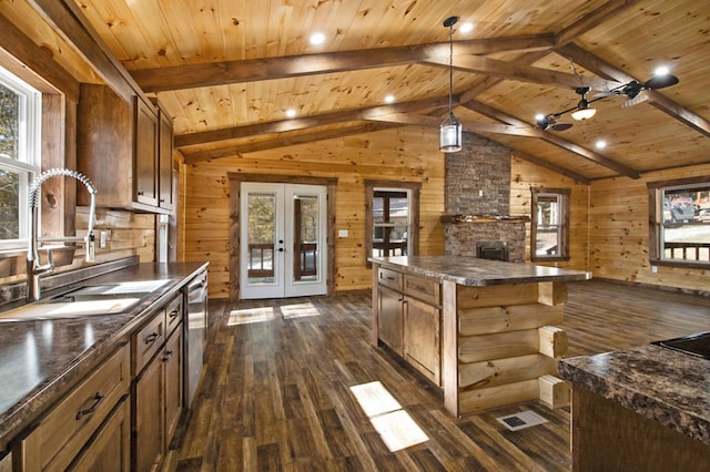 kitchen with a sink, french doors, a center island, dishwasher, and dark countertops