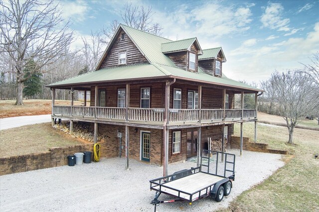 view of front of house with covered porch and metal roof