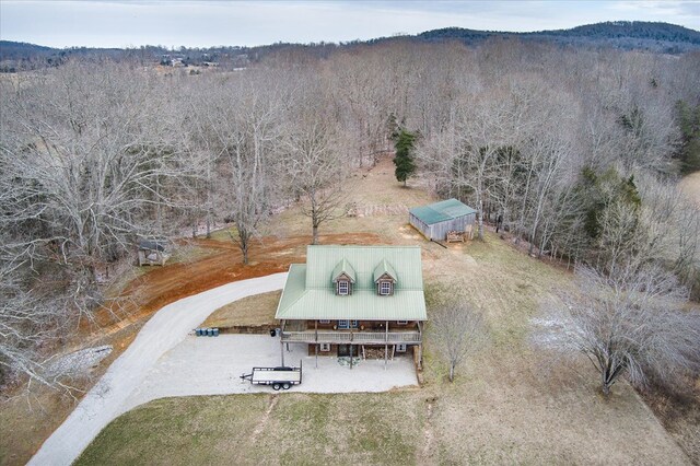 bird's eye view with a mountain view and a wooded view