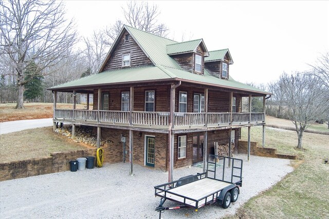 view of front of property with covered porch and metal roof