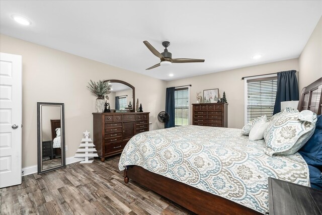 bedroom with ceiling fan, recessed lighting, wood finished floors, and baseboards