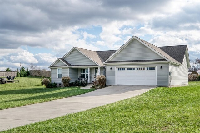 view of front of property with a garage, covered porch, concrete driveway, crawl space, and a front lawn