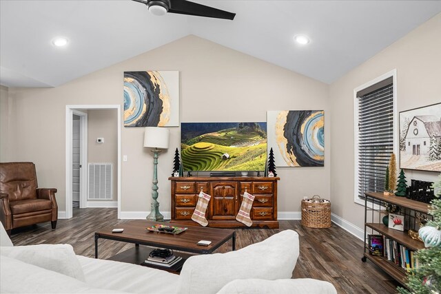 living room with dark wood finished floors, visible vents, vaulted ceiling, and baseboards