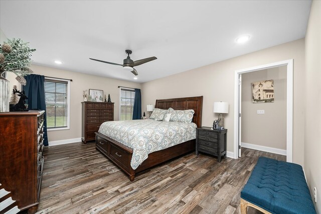 bedroom with dark wood-style floors, ceiling fan, recessed lighting, and baseboards