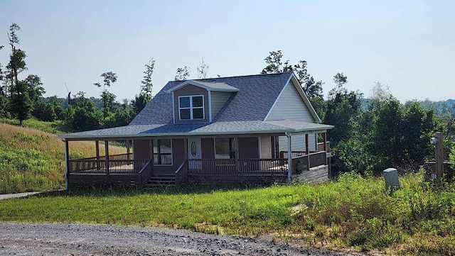 357 Taylor Rd, Byrdstown, TN 38549 - country-style home with a porch and a shingled roof