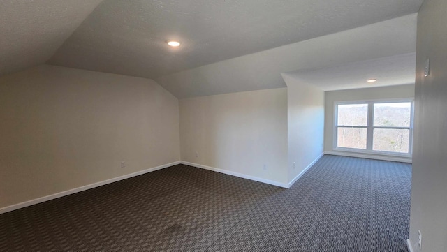 357 Taylor Rd, Byrdstown, TN 38549 - additional living space featuring dark carpet, vaulted ceiling, recessed lighting, and a textured ceiling