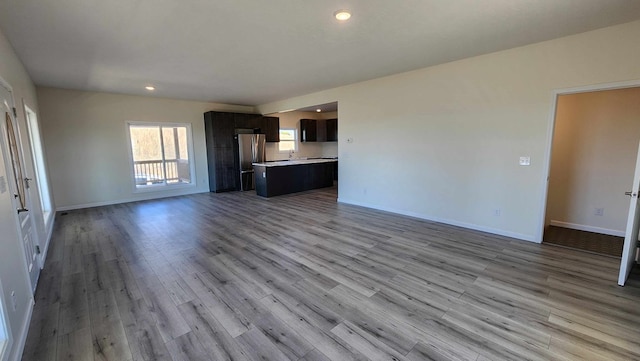 357 Taylor Rd, Byrdstown, TN 38549 - unfurnished living room with wood finished floors and recessed lighting