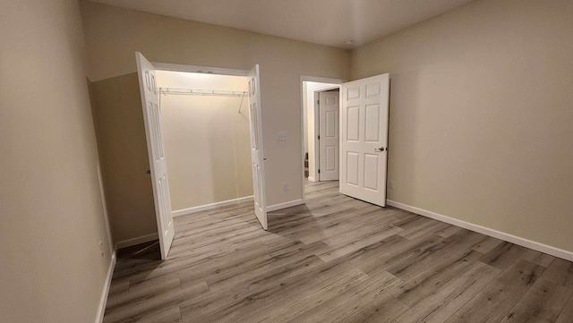 357 Taylor Rd, Byrdstown, TN 38549 - unfurnished bedroom with light wood-style floors and a closet