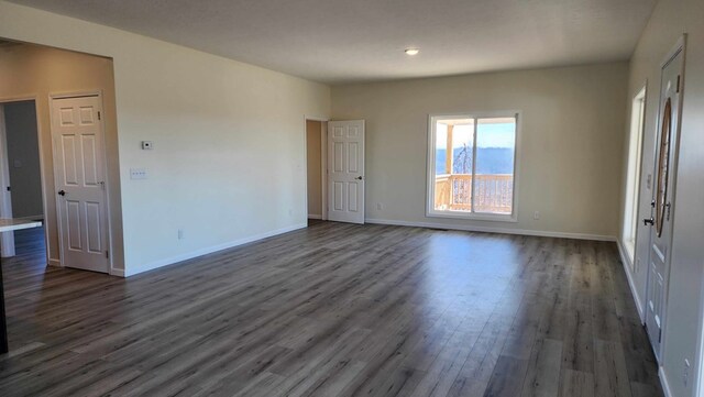 357 Taylor Rd, Byrdstown, TN 38549 - empty room featuring dark wood-type flooring and baseboards