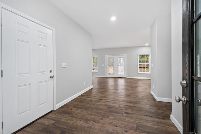 foyer with baseboards, french doors, dark wood-type flooring, and recessed lighting