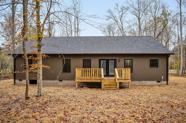 view of front facade featuring crawl space, a shingled roof, french doors, and a wooden deck