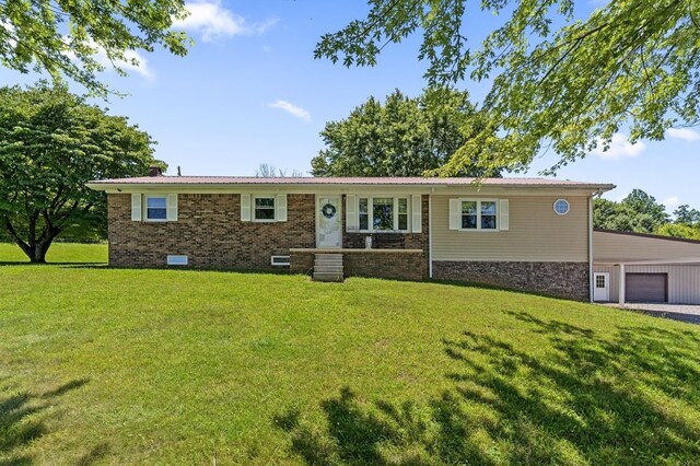 ranch-style home with brick siding, crawl space, metal roof, a garage, and a front lawn