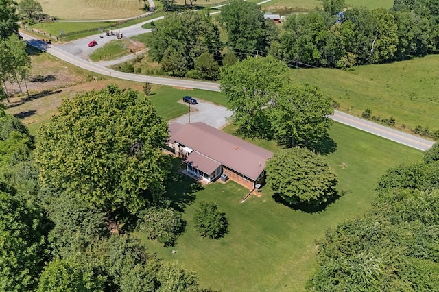 birds eye view of property with a rural view