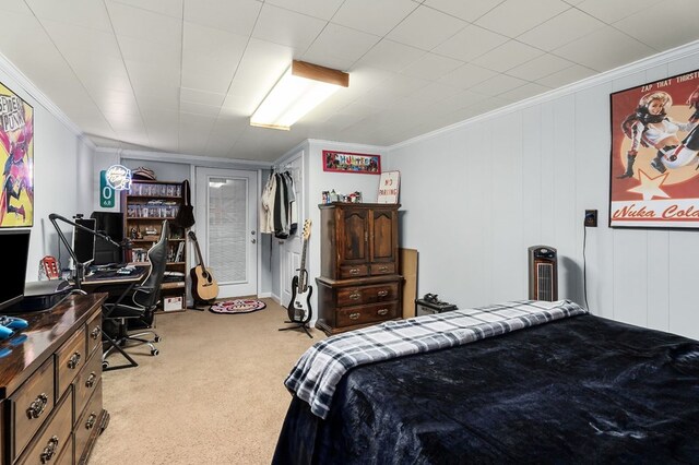 bedroom featuring ornamental molding and light carpet