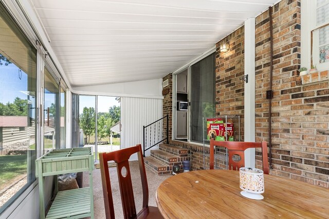 sunroom with lofted ceiling