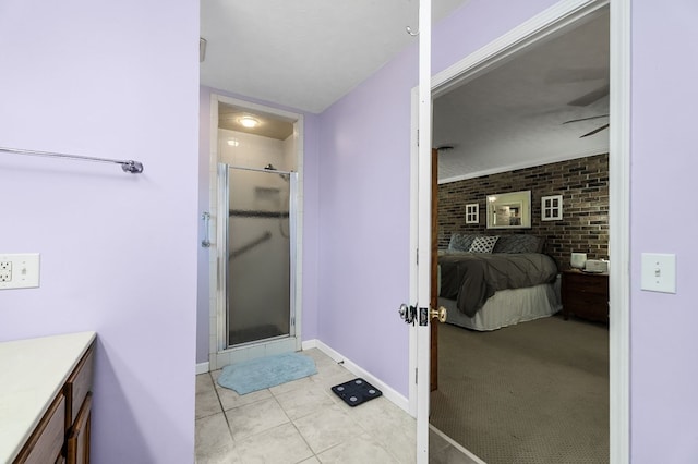 bathroom with brick wall, ensuite bath, vanity, and a shower stall