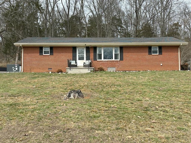 ranch-style house with crawl space, central AC unit, a front yard, and brick siding