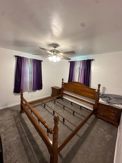 bedroom featuring carpet, baseboards, and a ceiling fan