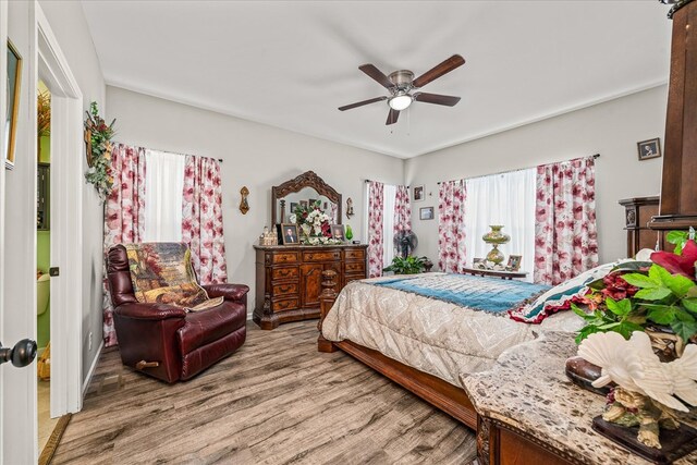 bedroom featuring ceiling fan and wood finished floors