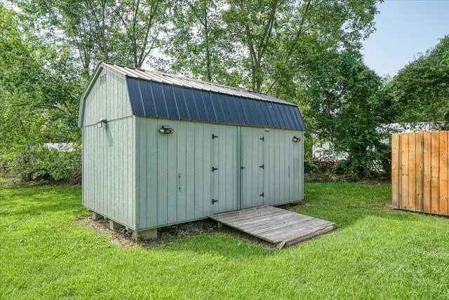 view of shed with fence