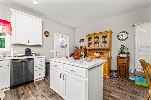 kitchen featuring dark wood-style floors, white cabinets, dishwasher, and a center island