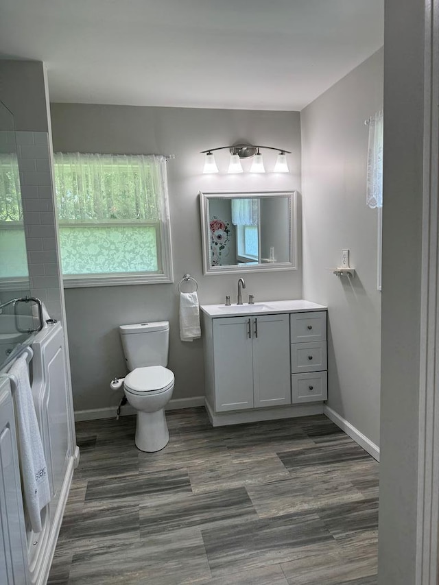 8298 Southfork Rd, Baxter, TN 38544 - bathroom with vanity, an enclosed shower, and wood finished floors
