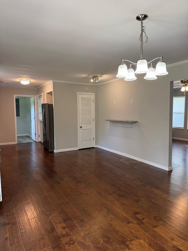 8298 Southfork Rd, Baxter, TN 38544 - unfurnished living room with ornamental molding, dark wood finished floors, and a chandelier