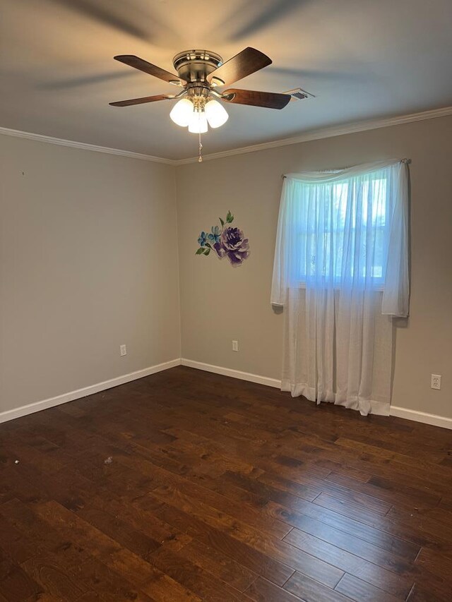 8298 Southfork Rd, Baxter, TN 38544 - spare room featuring a ceiling fan, dark wood-style flooring, and ornamental molding