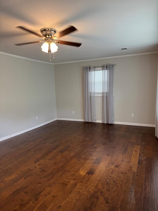 8298 Southfork Rd, Baxter, TN 38544 - empty room with dark wood finished floors, ornamental molding, and ceiling fan