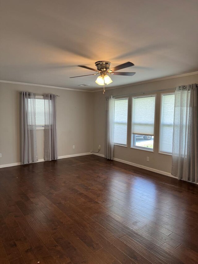 8298 Southfork Rd, Baxter, TN 38544 - spare room featuring plenty of natural light, ornamental molding, ceiling fan, and dark wood finished floors
