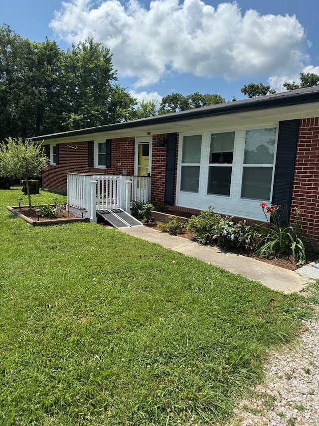8298 Southfork Rd, Baxter, TN 38544 - ranch-style home with brick siding and a front lawn