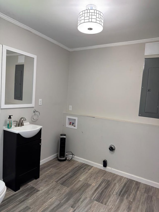 8298 Southfork Rd, Baxter, TN 38544 - laundry area featuring electric panel, wood finished floors, ornamental molding, and washer hookup