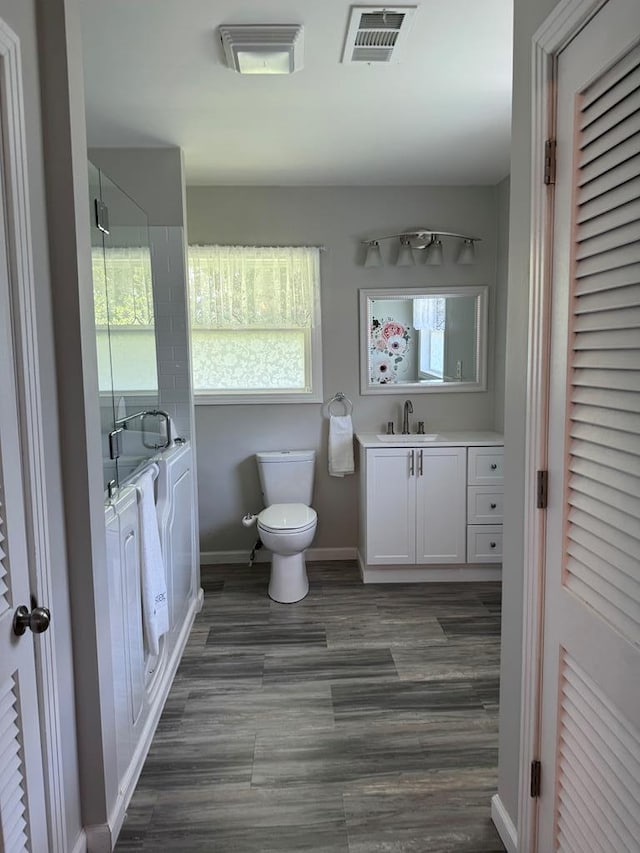 8298 Southfork Rd, Baxter, TN 38544 - full bathroom with vanity, an enclosed shower, plenty of natural light, and a closet