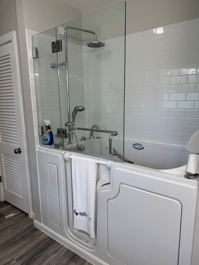 8298 Southfork Rd, Baxter, TN 38544 - bathroom featuring tiled shower and wood finished floors