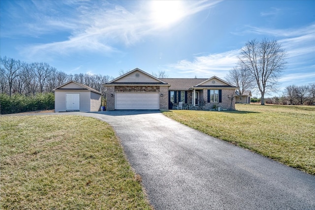 ranch-style home featuring a garage, a front lawn, aphalt driveway, and brick siding