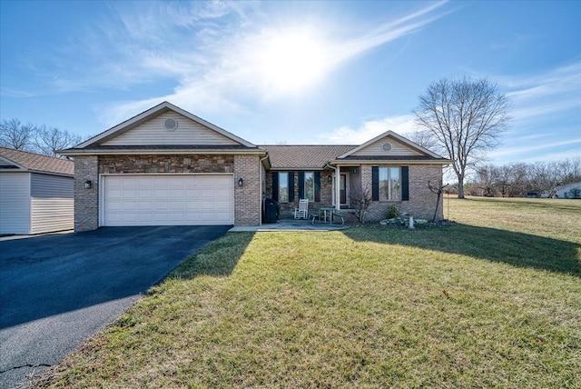 single story home with a garage, brick siding, aphalt driveway, and a front yard