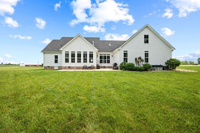 8275 Medlin Rd, Baxter, TN 38544 - back of property with crawl space, a lawn, a shingled roof, and a patio